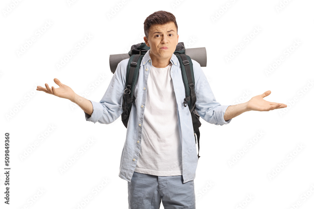 Confused young male backpacker gesturing with hands Confused young male backpacker gesturing with hands
