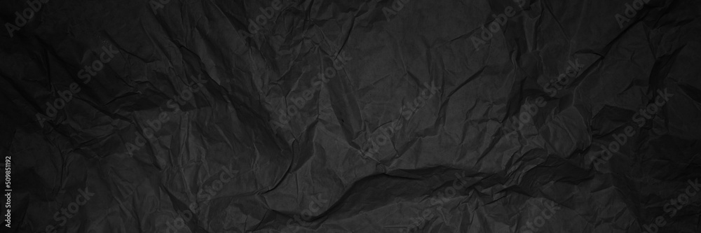 Fototapeta premium Black crumpled sheet of paper, banner