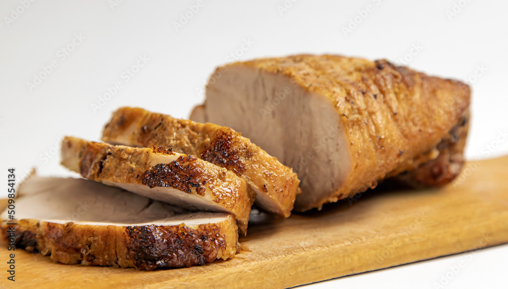 Cooking meat. Roast pork on a white background.