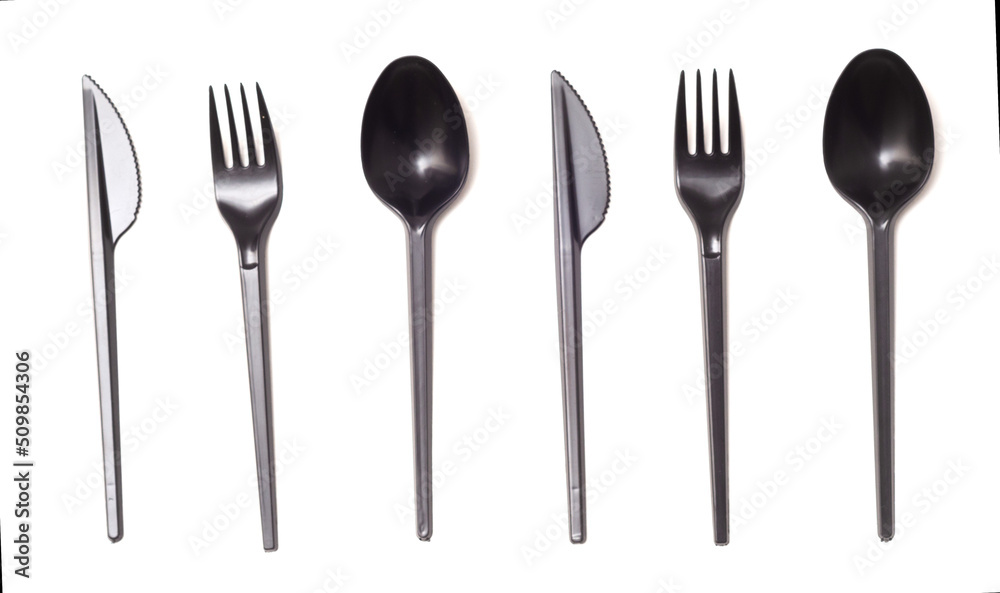 Repeating black plastic disposable knife,spoon and fork isolated on white, top view Repeating black plastic disposable knife,spoon and fork isolated on white, top view