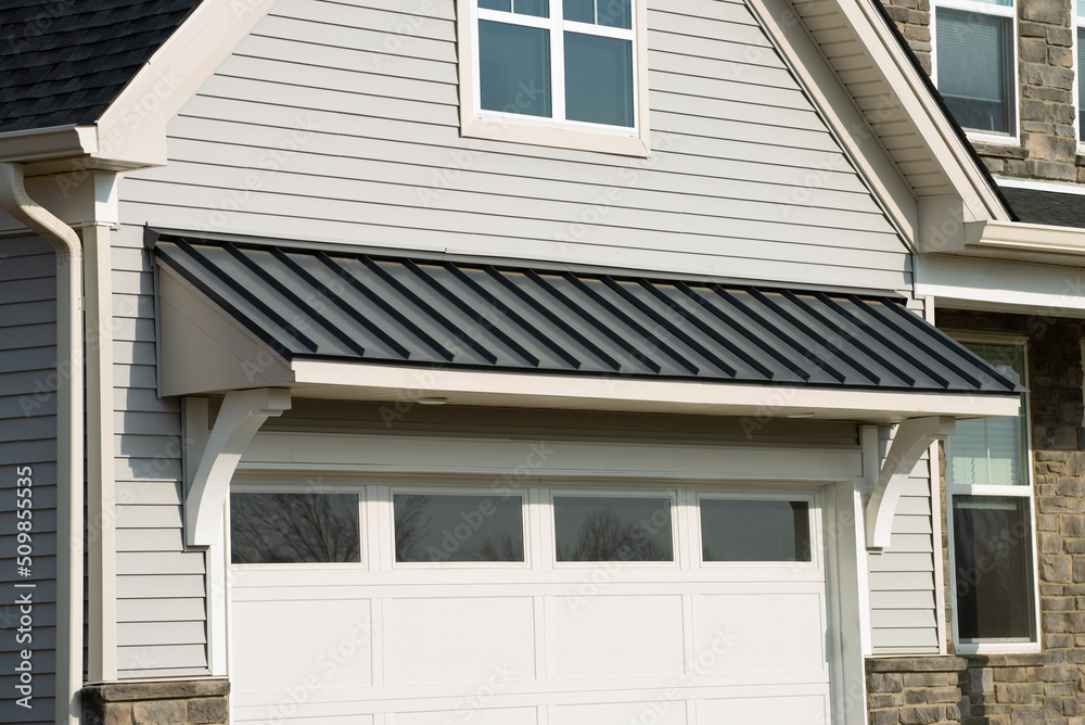 awning over garage door front home beautiful shade