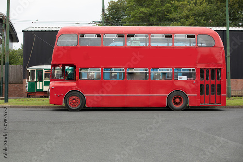 side view of red double decker bus copy space