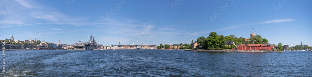 Harbor islands at the bay Ladugårdsviken , a castle and the schooner and training boats Gladan and Falken a sunny summer day in Stockholm