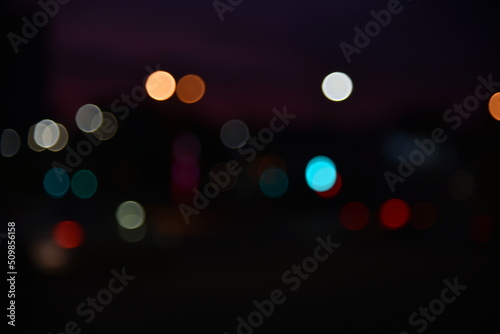 Defocused night traffic multicolored lights evening city Chelyabinsk strange background