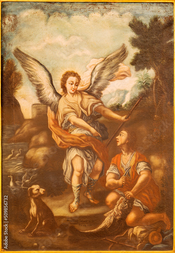 MONOPOLI, ITALY - MARCH 6, 2022: The painting of Thobias and Archangel Raphael  in the church Chiesa di San Antonio by  Anna Teresa Antonacci (1750).