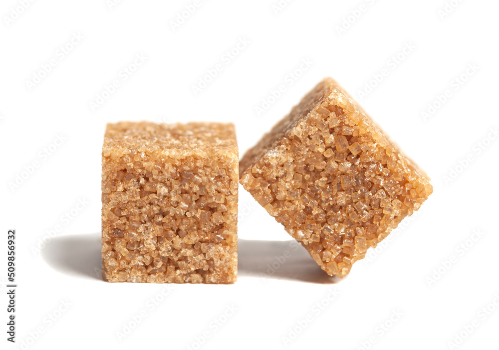 Two pieces brown cane sugar cubes isolated on white background Two pieces brown cane sugar cubes isolated on white background