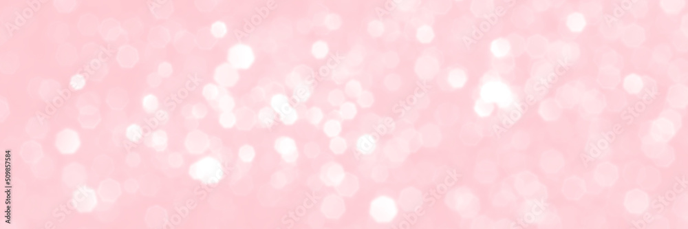 Pink sparkling glitter bokeh background, banner texture. Abstract defocused lights header. Wide screen wallpaper. Panoramic web banner with copy space for design