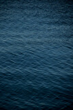 unfocused deep blue water waves background