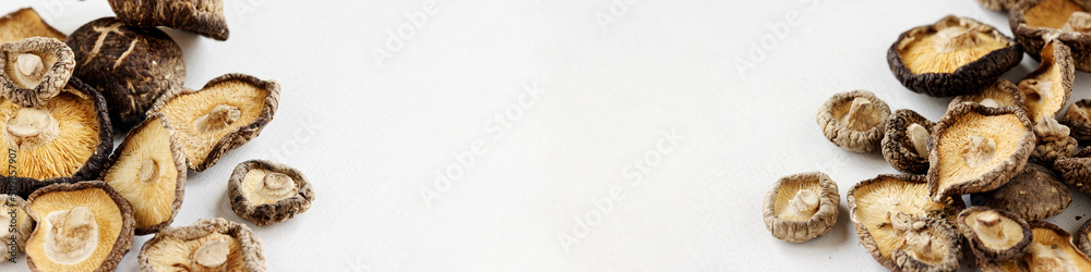 Shiitake Asian dry fungi banner with copy space. Dried mushrooms for cooking. Shiitake Asian dry fungi banner with copy space. Dried mushrooms for cooking.