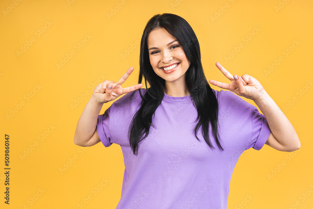 Portrait of happy smiling brunette girl in casual isolated over yellow background. Portrait of happy smiling brunette girl in casual isolated over yellow background.