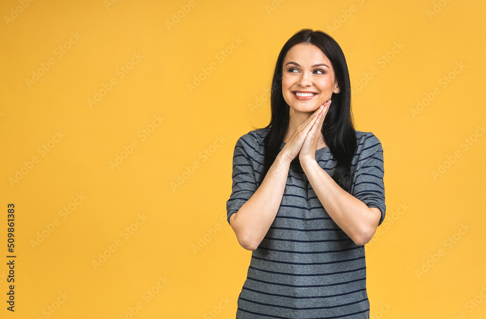 Portrait of happy smiling brunette girl in casual isolated over yellow background. Portrait of happy smiling brunette girl in casual isolated over yellow background.