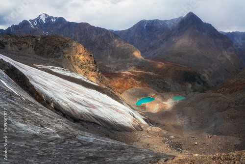 Nature background of dark glacier surface with cracks and scratc photo