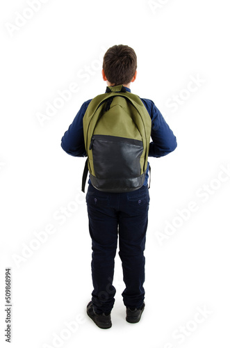 Back to school concept. Adorable schoolboy with backpacks looking at wall. Back view. Isolated on white background. Full length. Modern teenage boy with backpack looking at wall.
