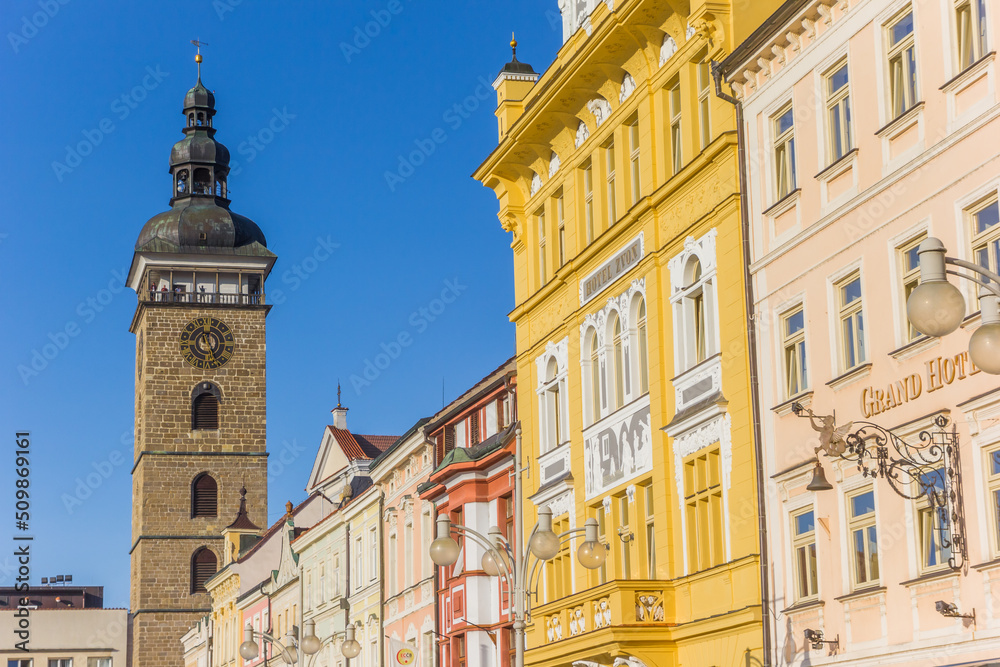 Facades of historic buildings and black tower in Ceske Budejovice, Czech Republic