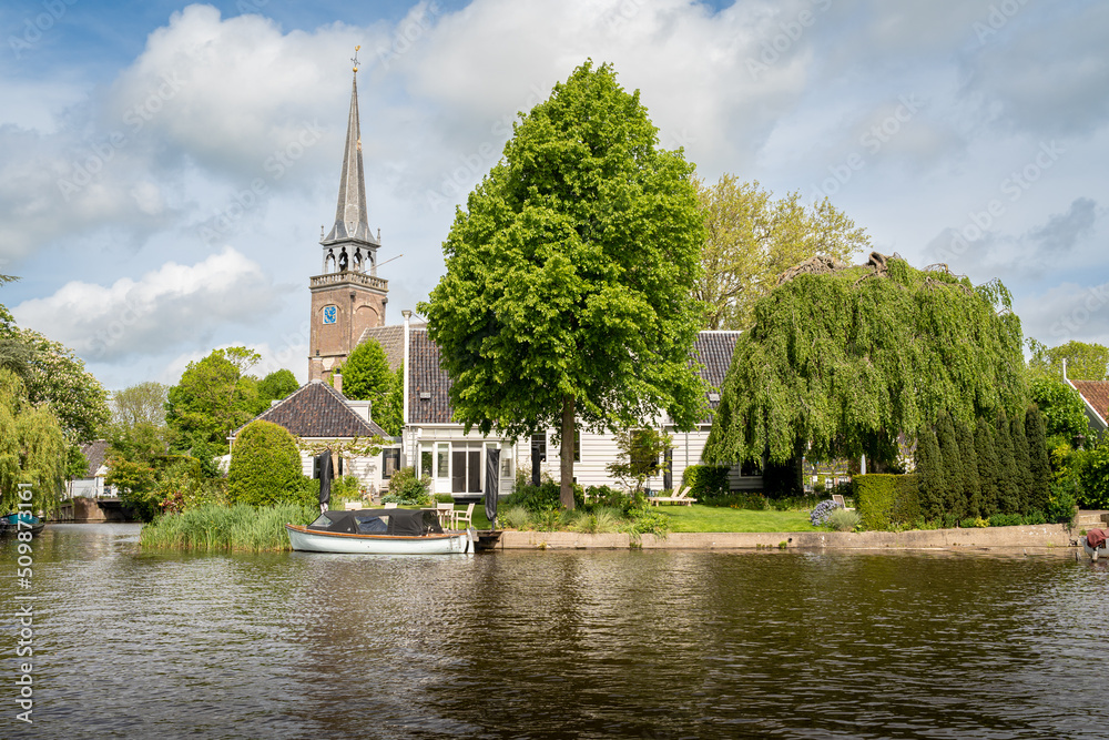 Picturesque dutch tourist village Broek in Waterland seen from the boat
