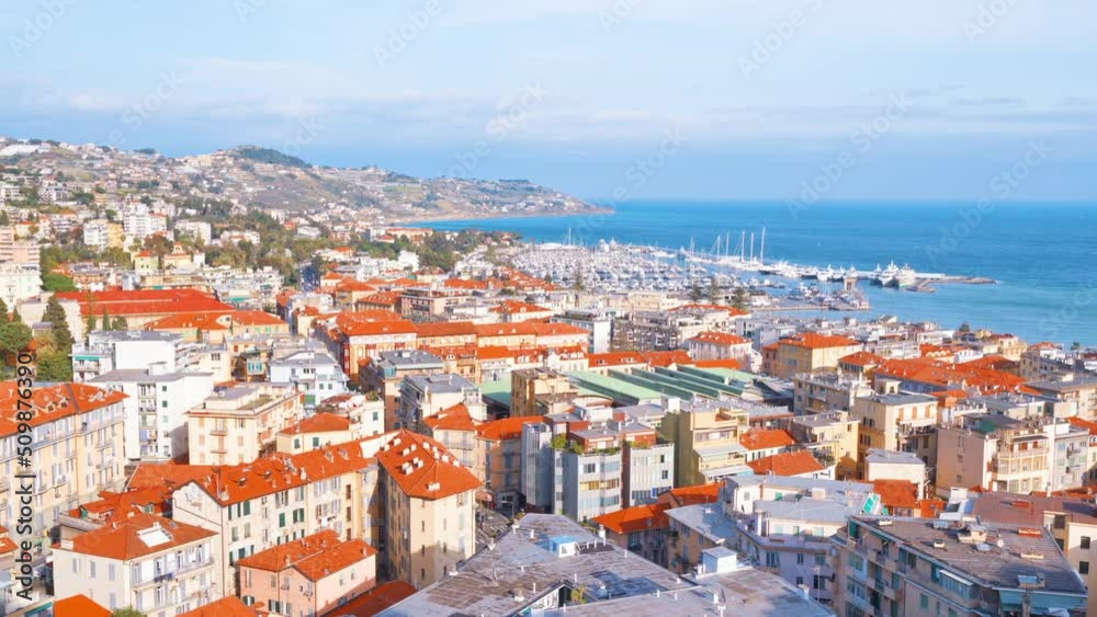 Cityscape of Sanremo, Italy. Residential buildings made in classic style, Mediterranean sea coast and sea port Cityscape of Sanremo, Italy. Residential buildings made in classic style, Mediterranean sea coast and sea port
