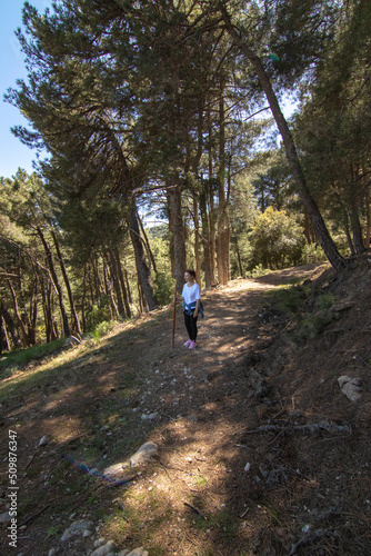 A middle-aged Caucasian woman hiking in the Sierra de Cazorla. Concept of the lifestyle of middle-aged people.