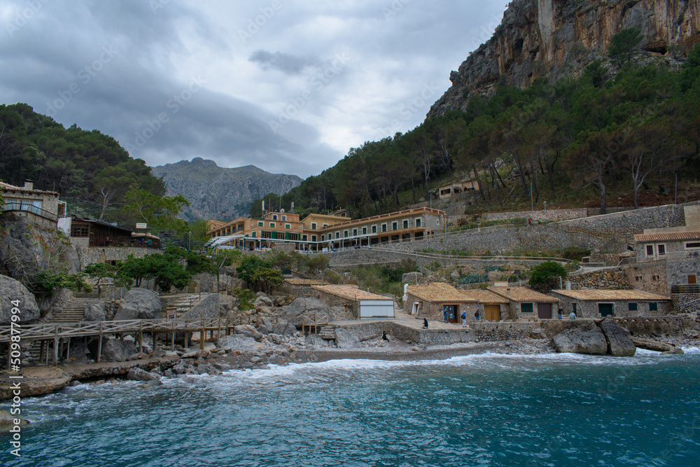 Sa Calobra, Mallorca, Spain - 05.05.2022: Turquoise sea water and cliffs in Sa Calobra port, Mallorca, Spain