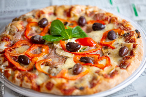 Pizza. Pizza delivery. Brilliant juicy hot pizza. Pizza in the oven. Margarita. hot food photography. Fast food. Home delivery. Favorite Italian food. Tasty food. Dinner. Pizza with olives. Cheese. 