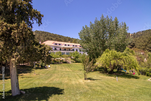 The exterior of the Hotel Parador De Cazorla  located in the Sierra de Cazorla. Surrounded by hills and nature.