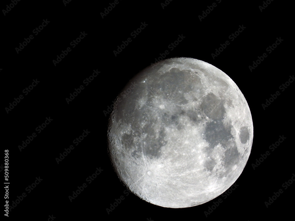 The moon at night in the sky captured from the earth The moon at night in the sky captured from the earth