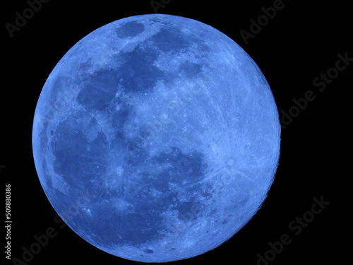 Fototapete Blue moon at night in the sky captured from the earth