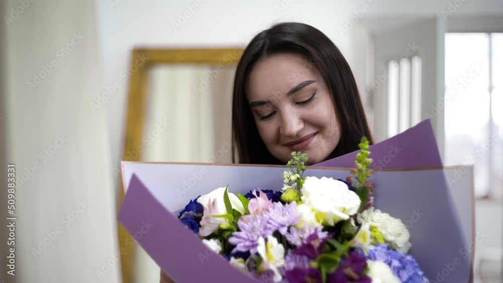 Close-up of a girl giving a bouquet of beautiful flowers. Flowers Close-up of a girl giving a bouquet of beautiful flowers. Flowers