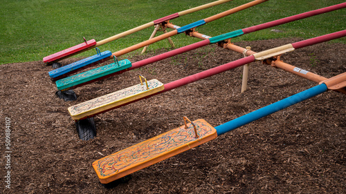 Colorful seesaws at a public park © frank1crayon