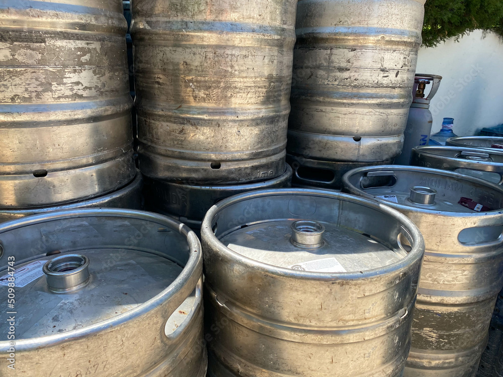 metal barrels at a construction site. large containers for liquid and bulk building materials. barrels have a black lid so as not to spill the liquid metal barrels at a construction site. large containers for liquid and bulk building materials. barrels have a black lid so as not to spill the liquid