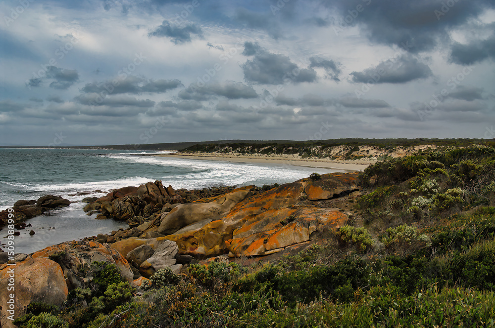 The wild, remote coast of Donington Peninsula, part of Lincoln National Park, Eyre Peninsula, South Australia, with lichen covered rocks, deserted beaches and dunes
