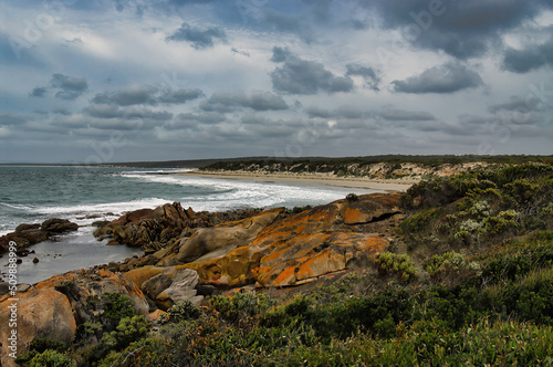The wild, remote coast of Donington Peninsula, part of Lincoln National Park, Eyre Peninsula, South Australia, with lichen covered rocks, deserted beaches and dunes 