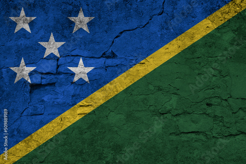 Patriotic cracked wall background in colors of national flag. Solomon Islands