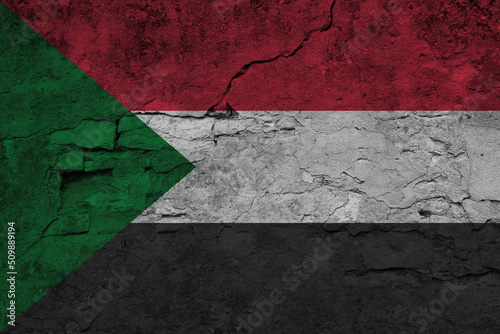 Patriotic cracked wall background in colors of national flag. Sudan © Julia