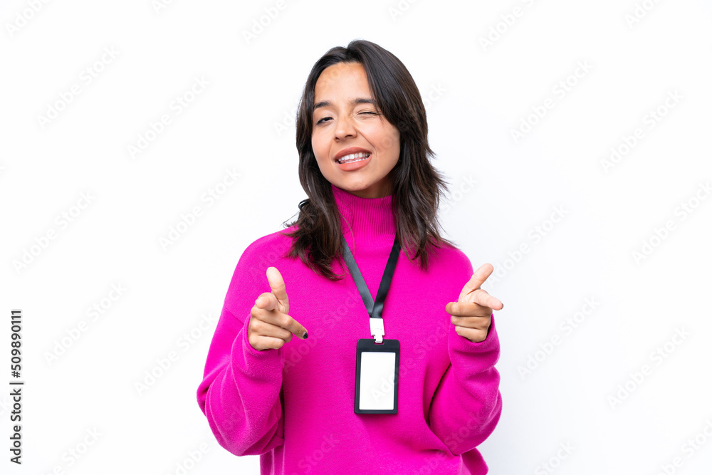 Young hispanic woman with ID card isolated on white background pointing to the front and smiling Young hispanic woman with ID card isolated on white background pointing to the front and smiling