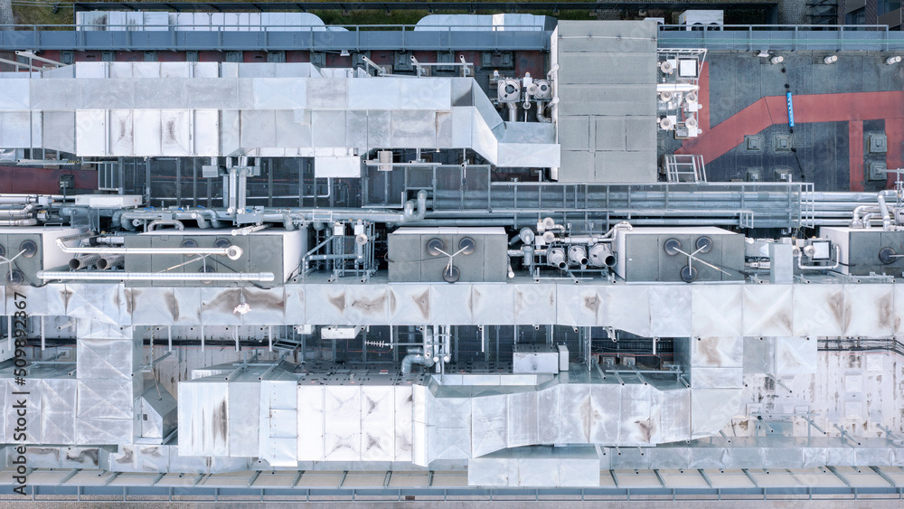 Air conditioning system on the roof of the building, advanced air conditioning and ventilation system, aerial view down the roof of the house, many different ventilation ducts Air conditioning system on the roof of the building, advanced air conditioning and ventilation system, aerial view down the roof of the house, many different ventilation ducts