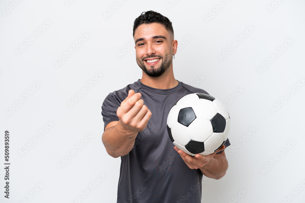 Arab young football player man isolated on white background making money gesture
