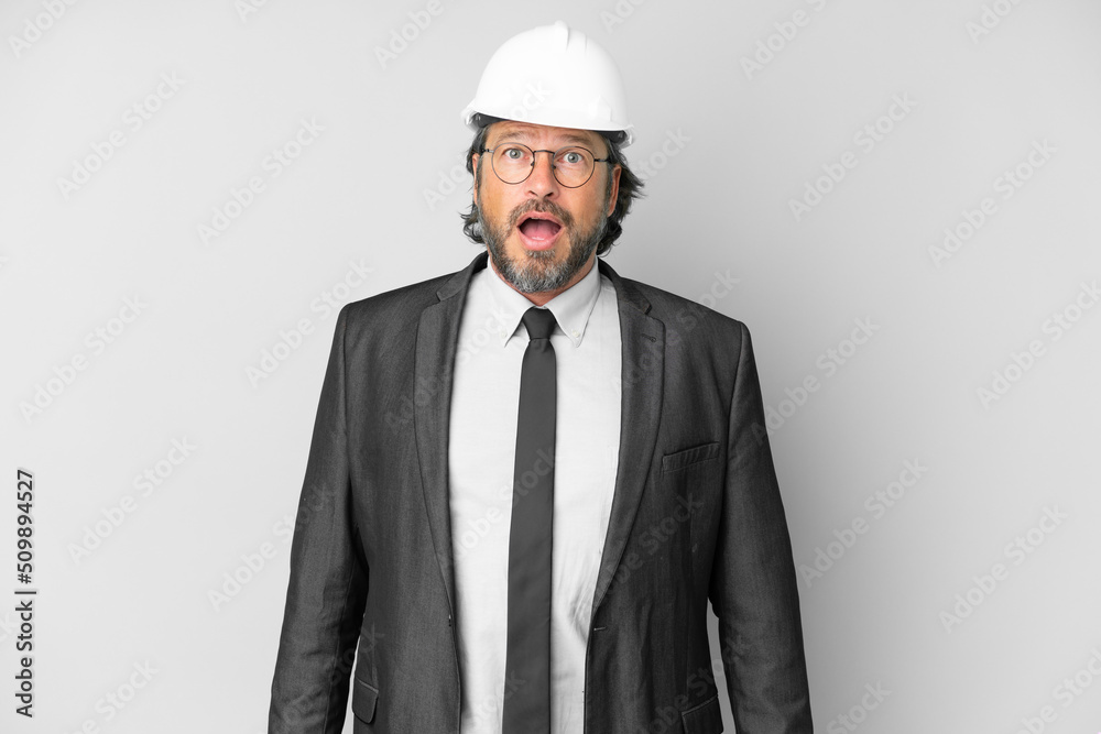 Young architect man with helmet over isolated background with surprise facial expression Young architect man with helmet over isolated background with surprise facial expression