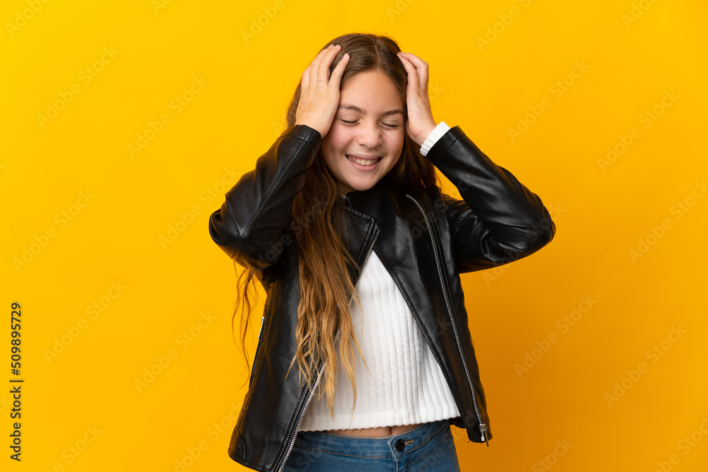Child over isolated yellow background laughing Child over isolated yellow background laughing