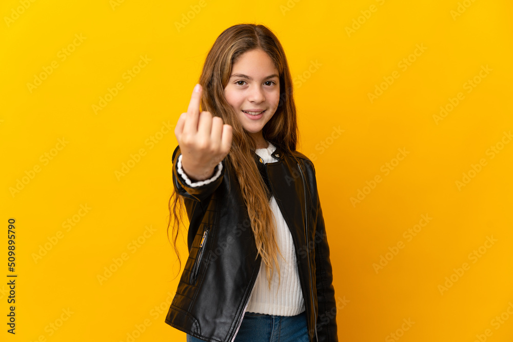 Child over isolated yellow background doing coming gesture Child over isolated yellow background doing coming gesture