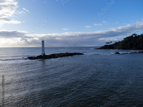 Maritime lighthouse on beautiful beach crossing with river - Itacaré, Bahia, Brazil