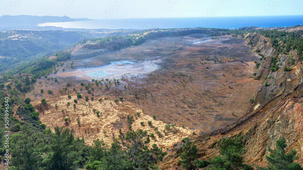 Ecosystem restoration. Aerial panorama of backfilled open pit Limni copper mine near Polis, Cyprus Ecosystem restoration. Aerial panorama of backfilled open pit Limni copper mine near Polis, Cyprus