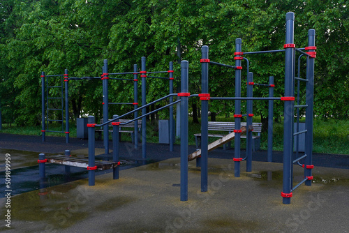 Playground for workout in a public park after a rain