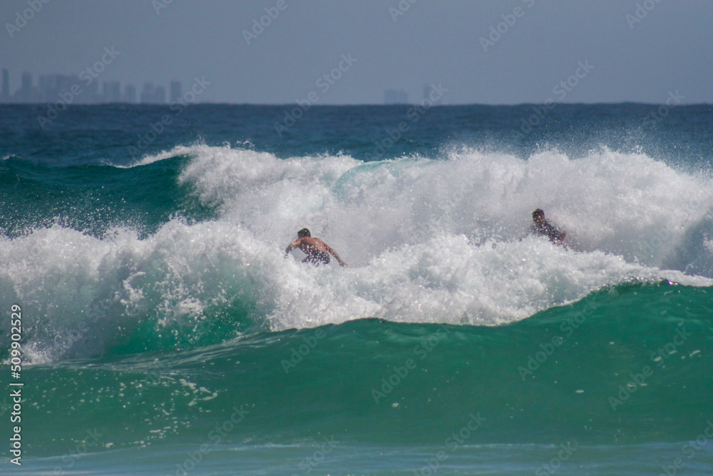 Huge Surf Smashing Surfers in Whitewash