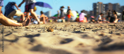Wallpaper Mural Sand on the beach. People are resting. Blurred. Torontodigital.ca