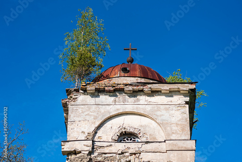 Ruins of Saliena lutheran church, Latvia. A tree grows on the roof of the tower.