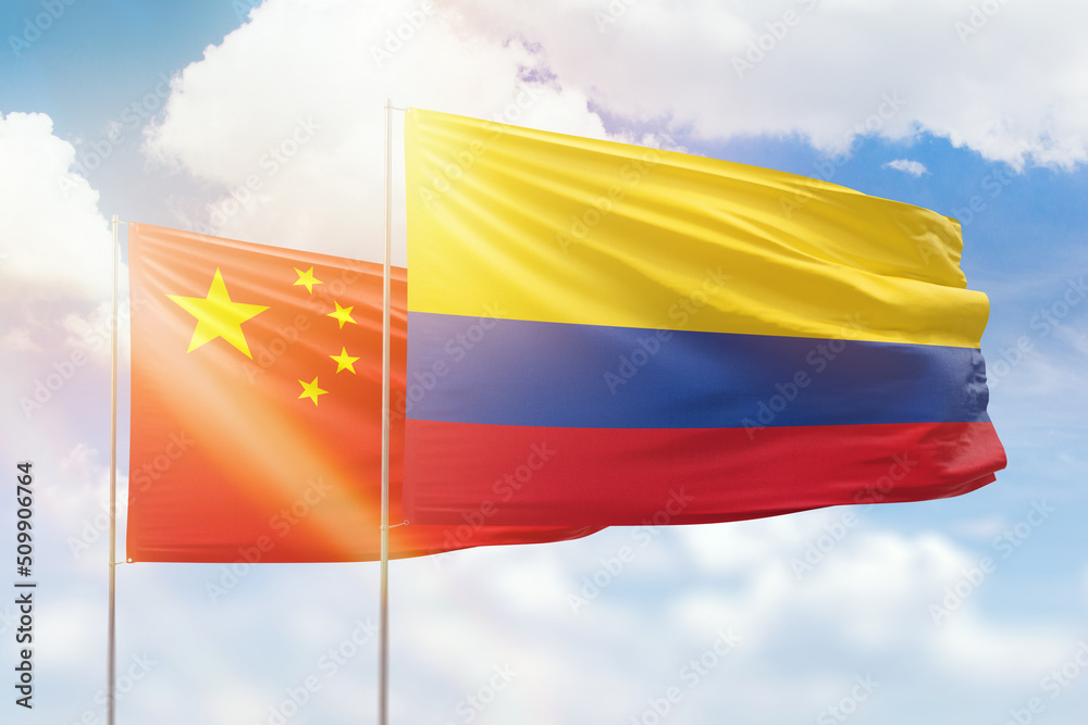Sunny blue sky and flags of colombia and china Sunny blue sky and flags of colombia and china