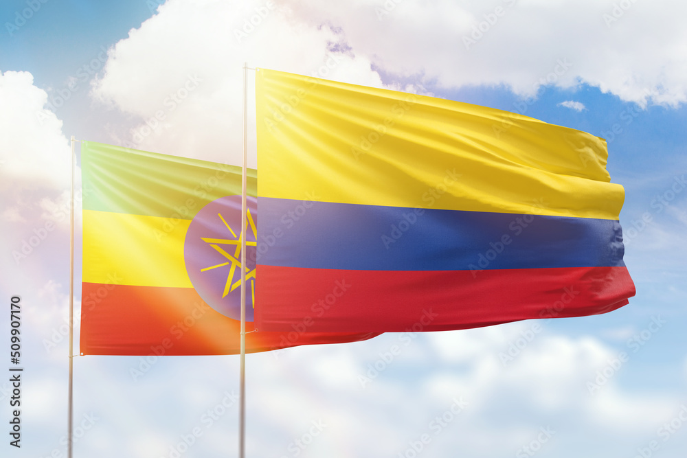 Sunny blue sky and flags of colombia and ethiopia Sunny blue sky and flags of colombia and ethiopia