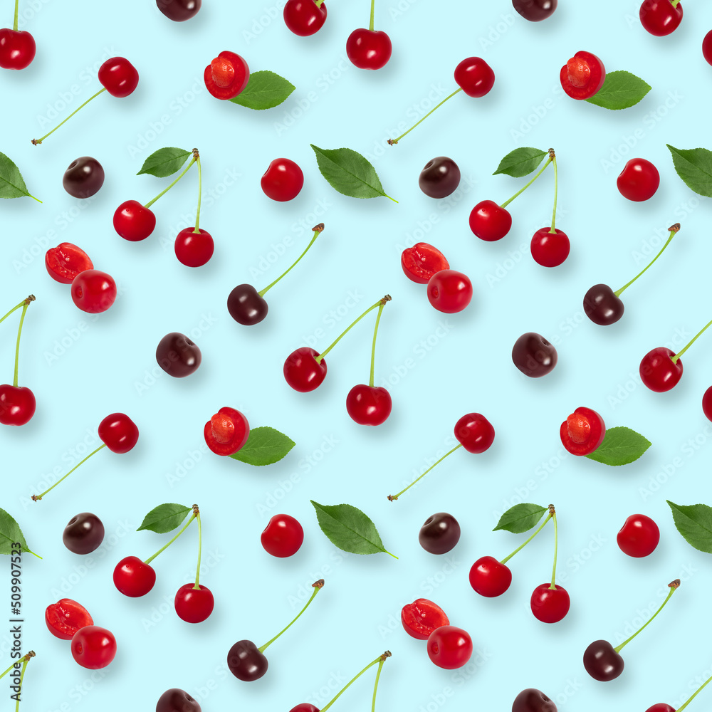 Cherry seamless pattern on blue background. Berry pattern. Summer background. Top view, flat lay. Cherry seamless pattern on blue background. Berry pattern. Summer background. Top view, flat lay.