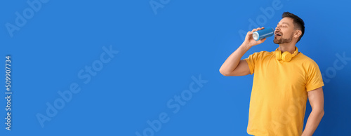 Handsome man with soda and ...