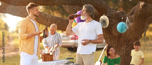 Happy family at barbecue pa...